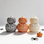 Three stacked pumpkin castings with stitched upper faces and jack-o-lantern bodies