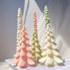 Broad tiered trees beside slender taper examples