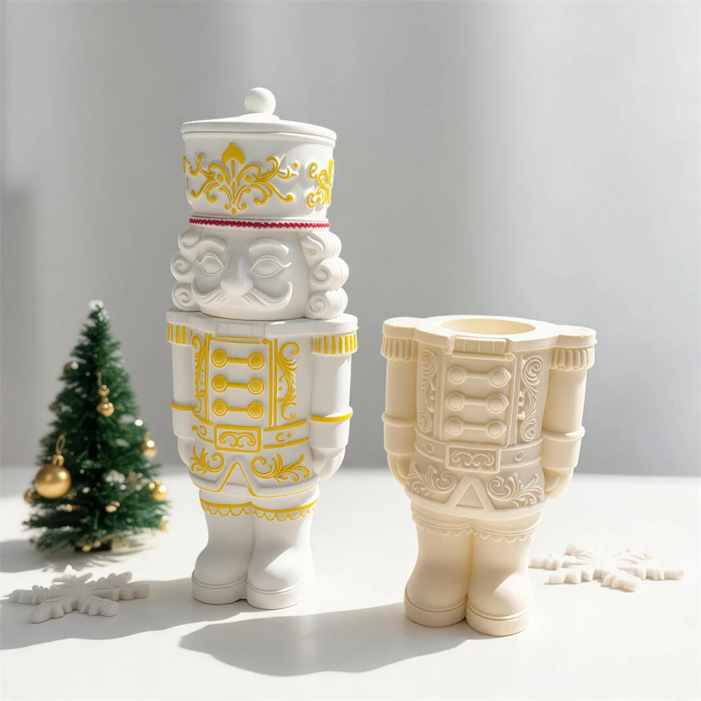 Gold-trimmed nutcracker soldier vessel beside open container casting