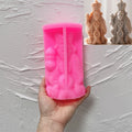 Pink SZ805 bearded figure mold beneath finished examples