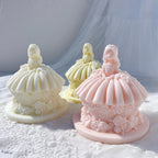 Full-skirt princess figures above rose-trimmed cake bases