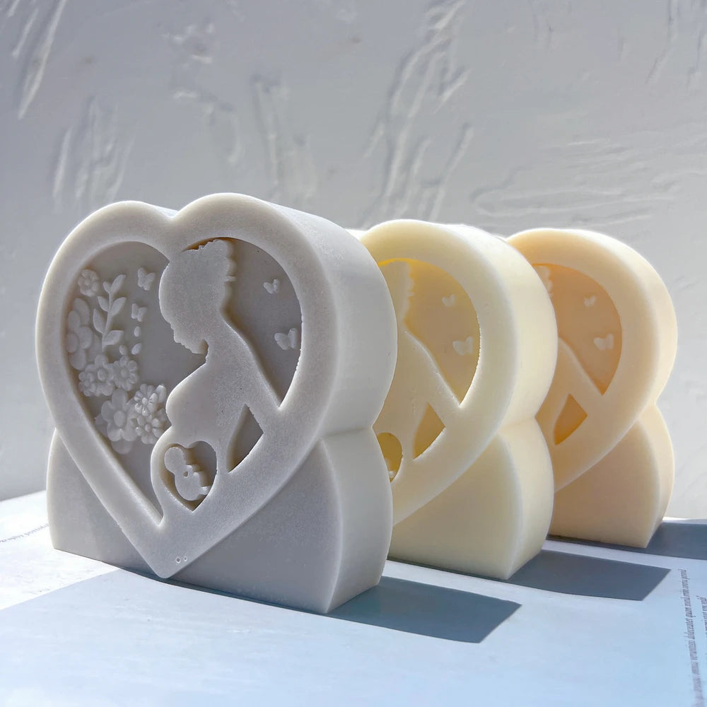 Angled pregnancy reliefs showing flowers and small belly hearts