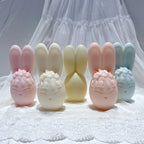 Flower-crowned bunny egg candles with tall ears in pastel colors