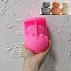 Pink silicone stacked pumpkin character mold held in a hand