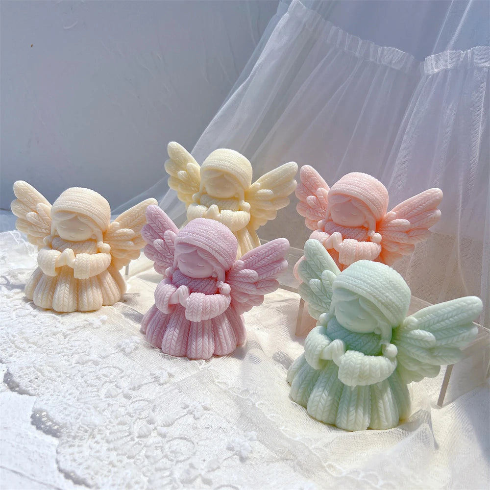 Angled display of praying angels with feathered wings