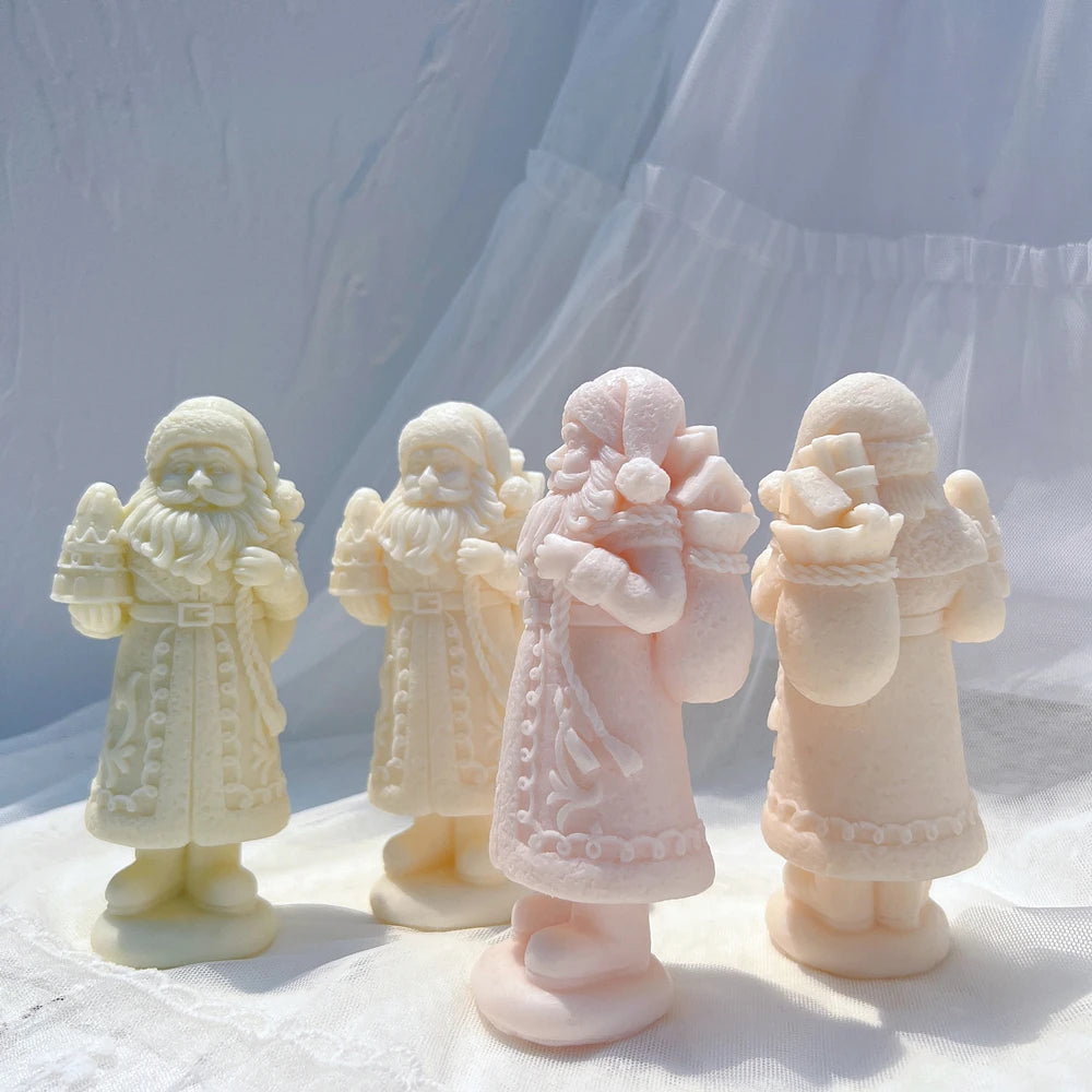 Santa castings showing decorated coats and gift sacks