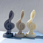 Three freestanding treble clef figures with curved musical detail