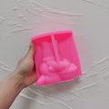 Pink silicone gnome mold showing the egg-basket scene cavity