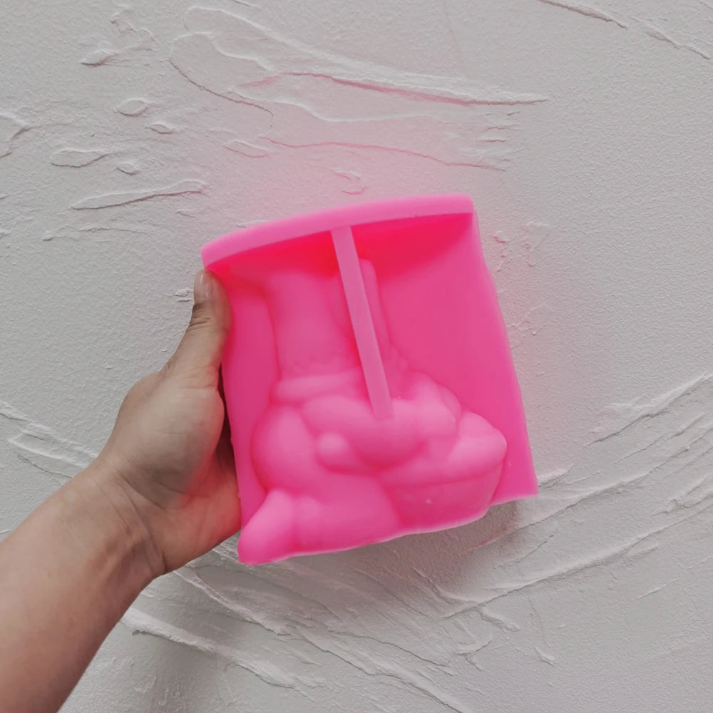 Pink silicone gnome mold showing the egg-basket scene cavity