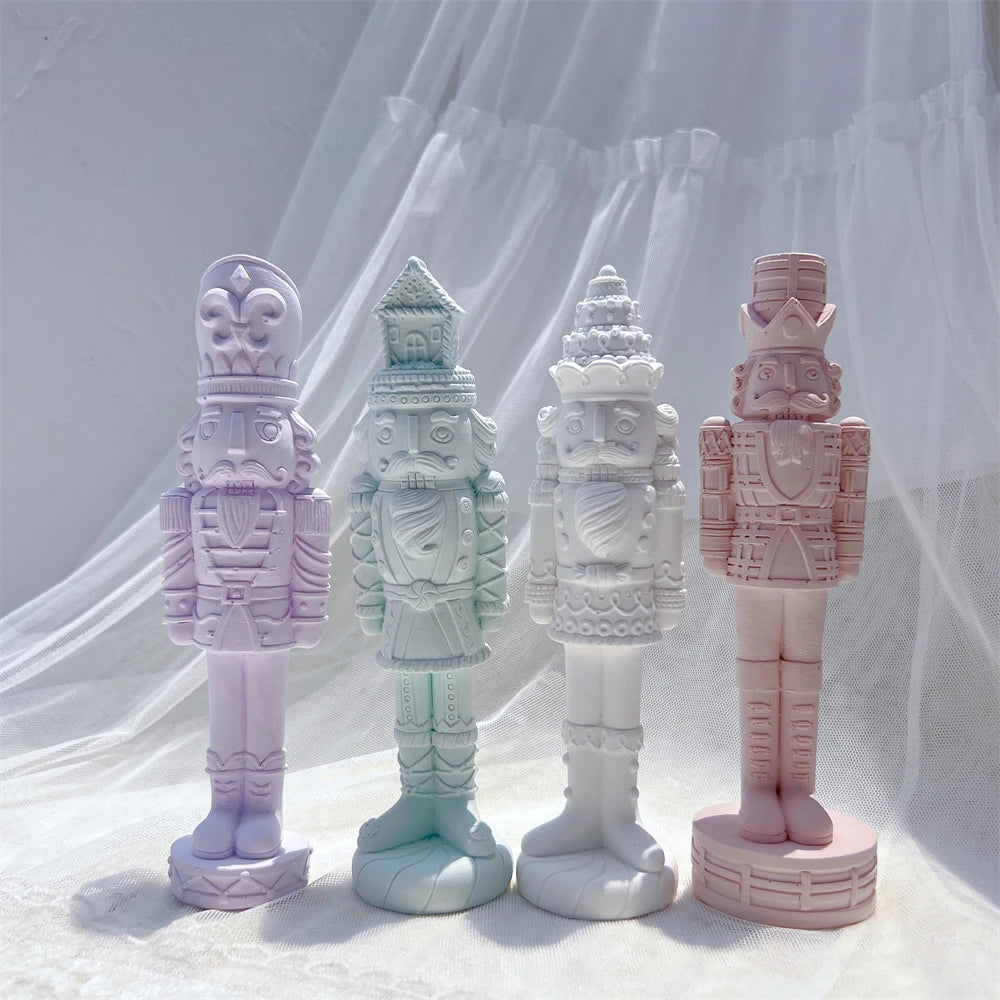 Purple green cream and pink nutcracker figures with contrasting hat styles