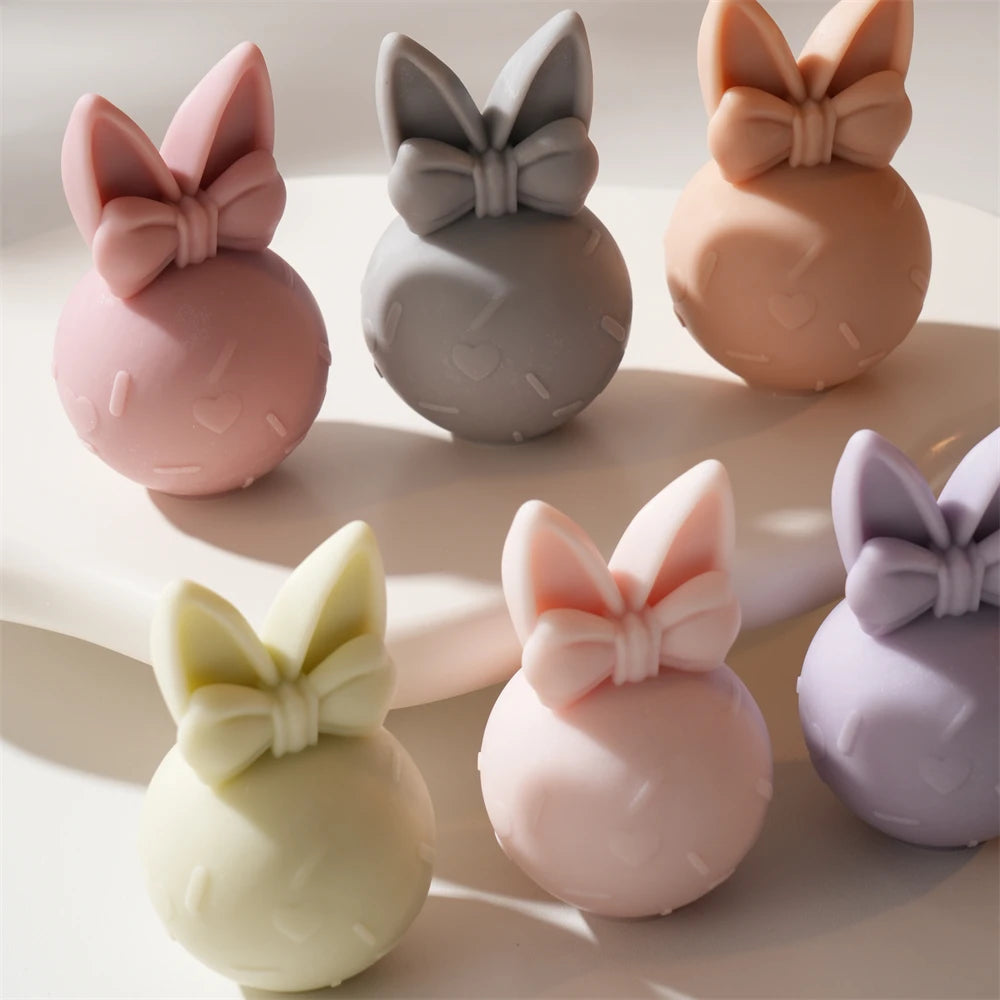 Overhead view of pastel egg bunnies with bows