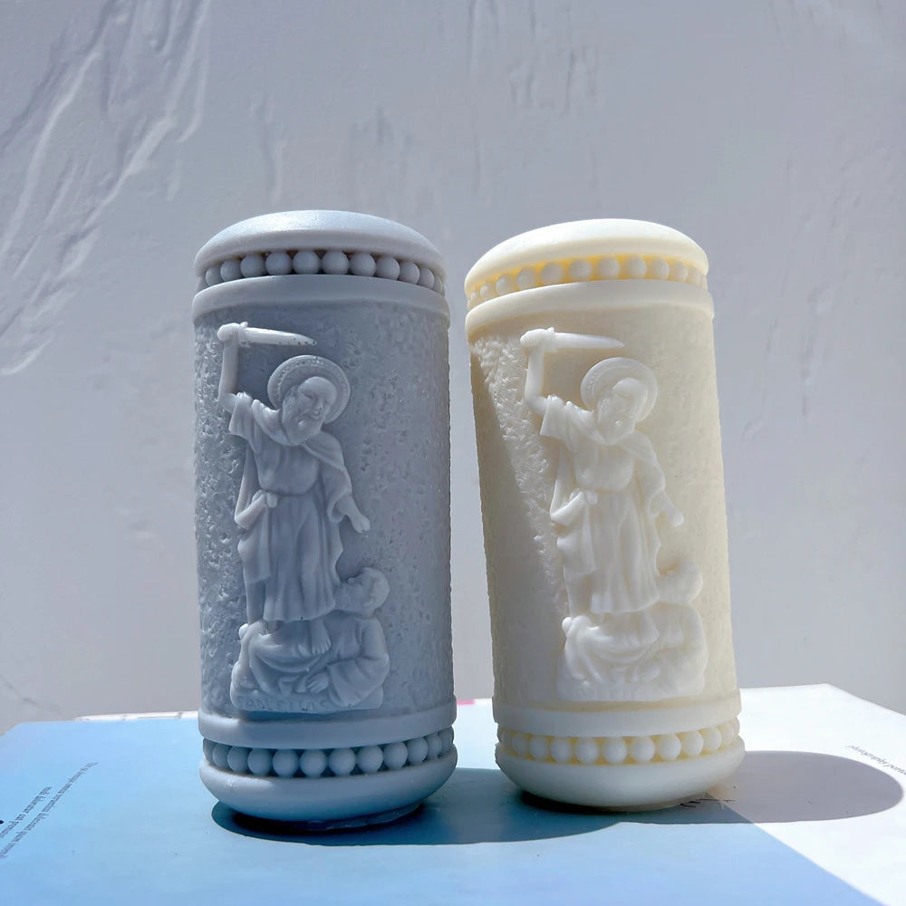 Two cylindrical castings with raised figures and decorative borders