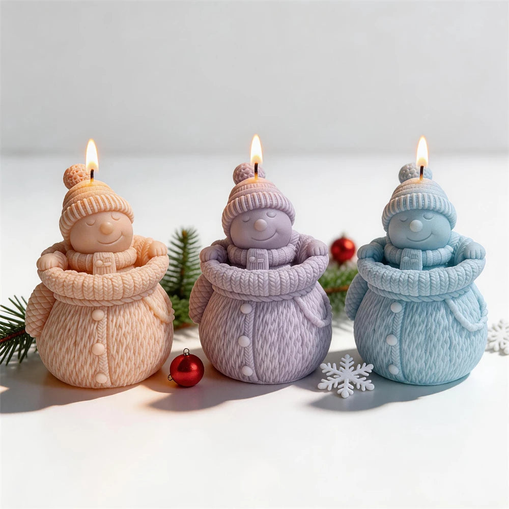 Cream, lavender and blue snowman candles with pompom hats