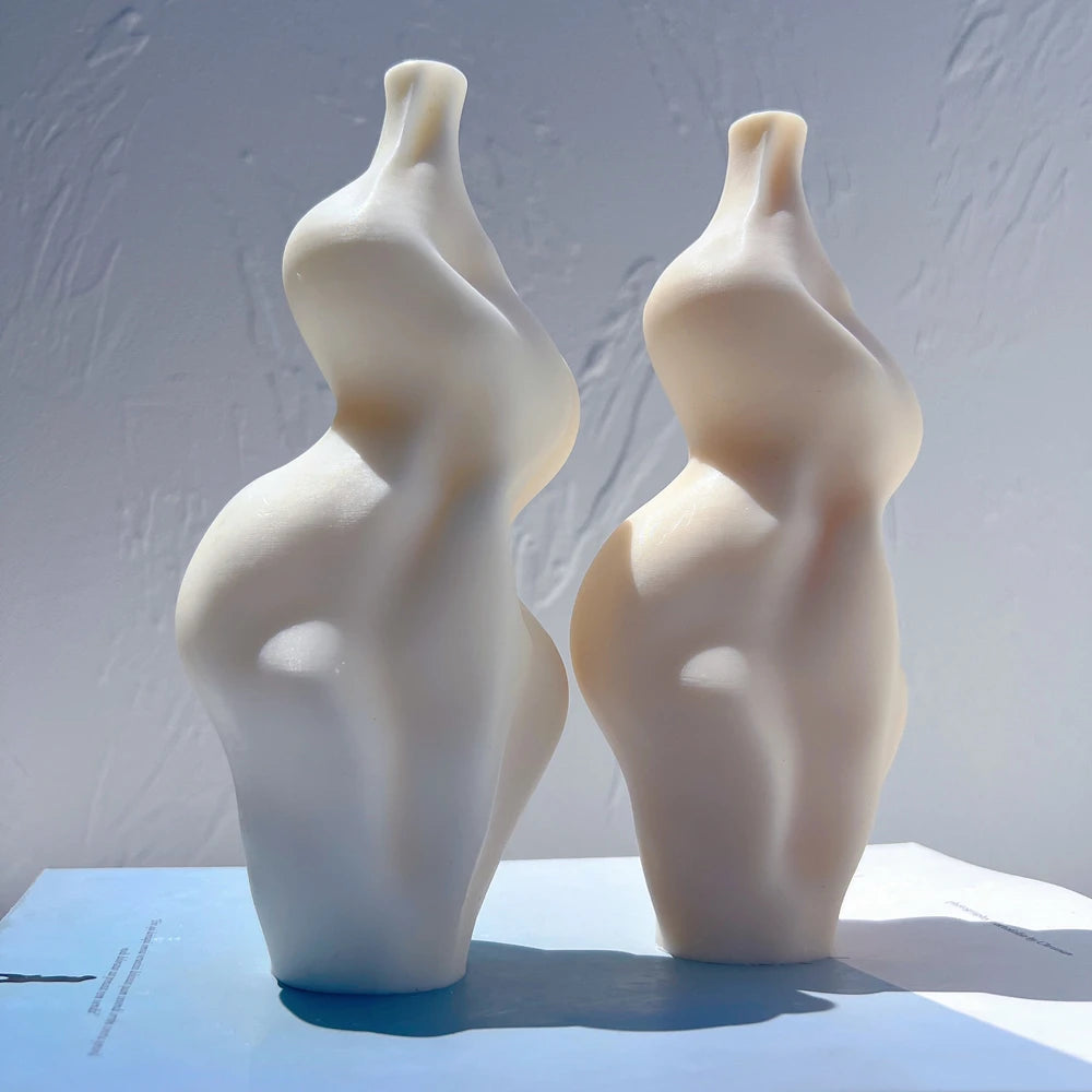 Paired abstract castings showing asymmetric contours