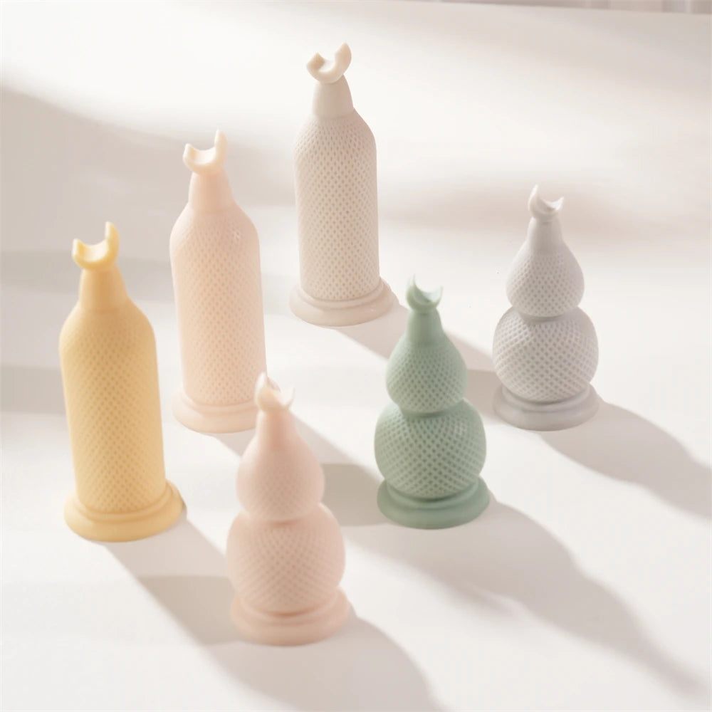 Six Ramadan crescent pillar candles arranged by varied height and decorative texture