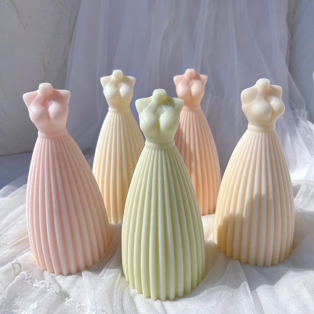 Flared dress candle castings showing bodice and skirt details