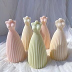 Flared dress candle castings showing bodice and skirt details
