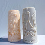 Two cylindrical castings with curling fern stems