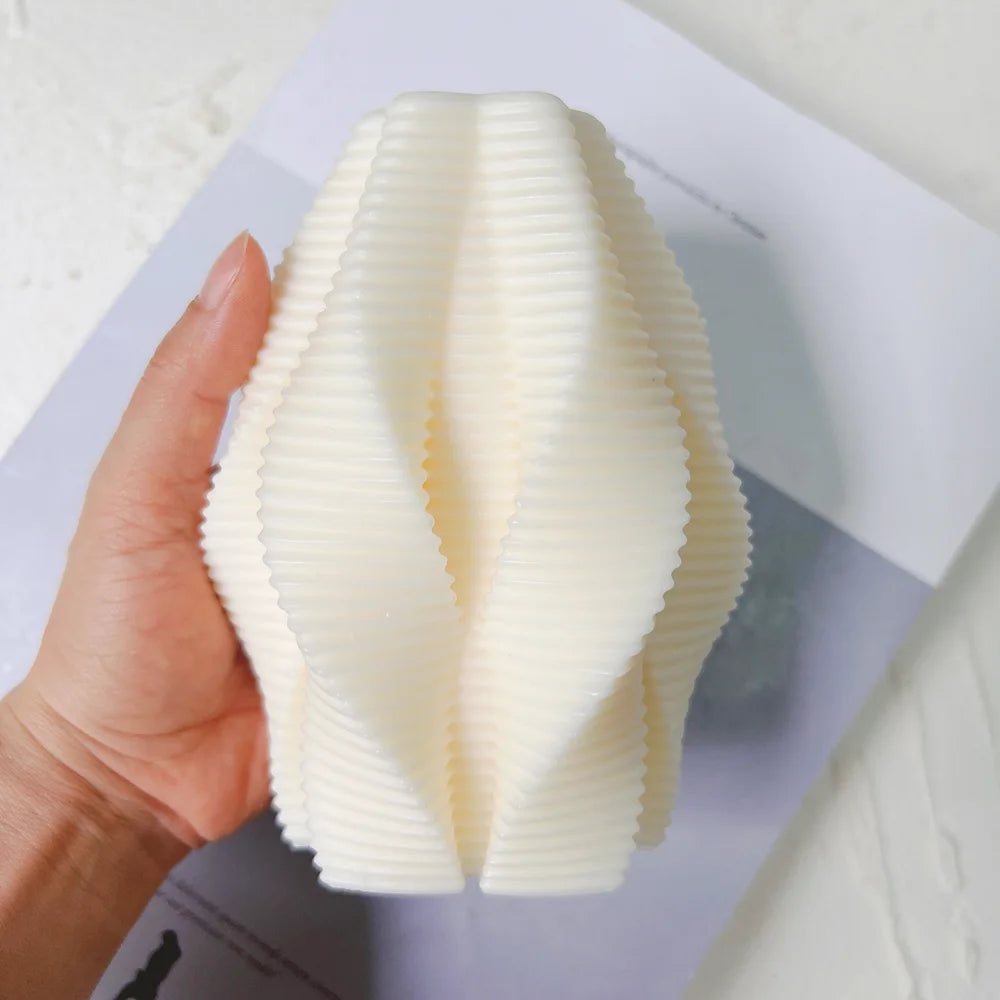 Wave casting held to show folded ribs and scalloped upper edge