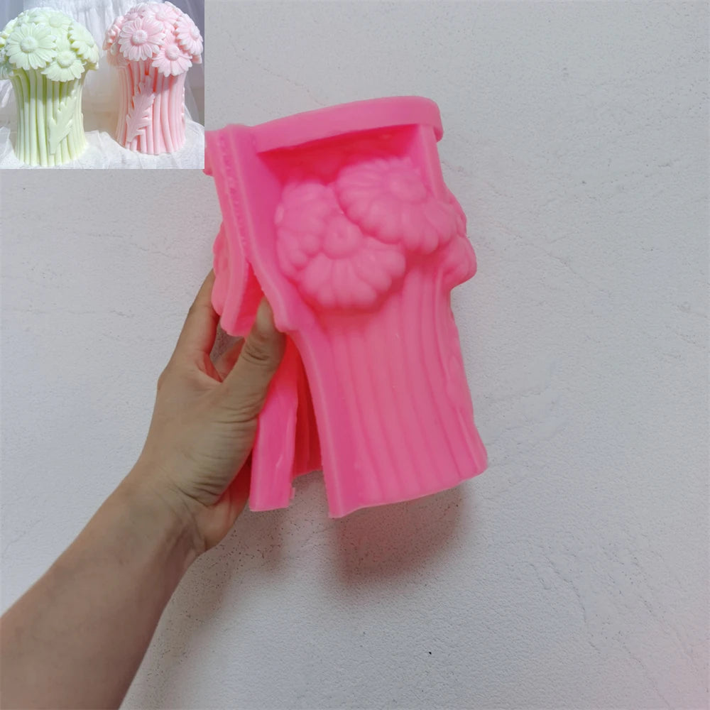 Pink silicone Daisy bouquet mold held open with flower and stem cavities