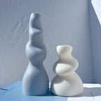 Wavy column beside a compact soft twist casting