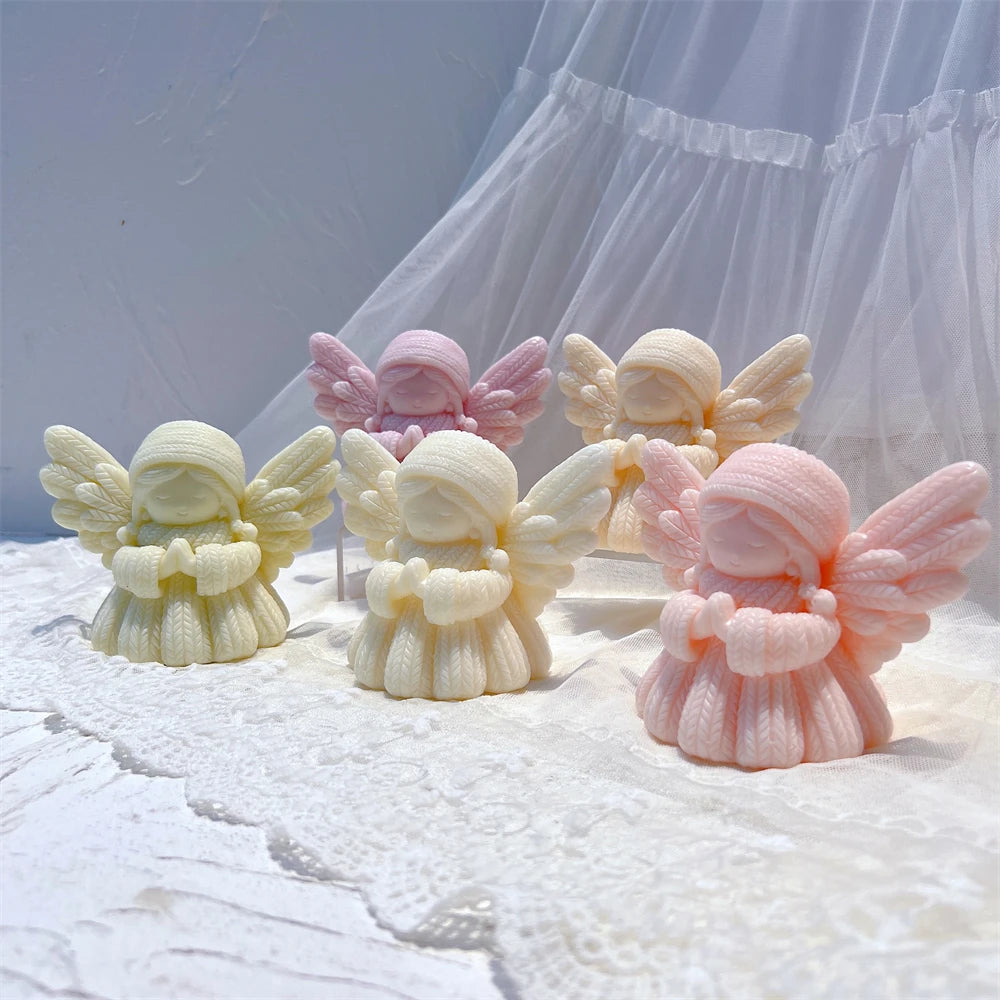Knit-textured angel figures in pink yellow and green