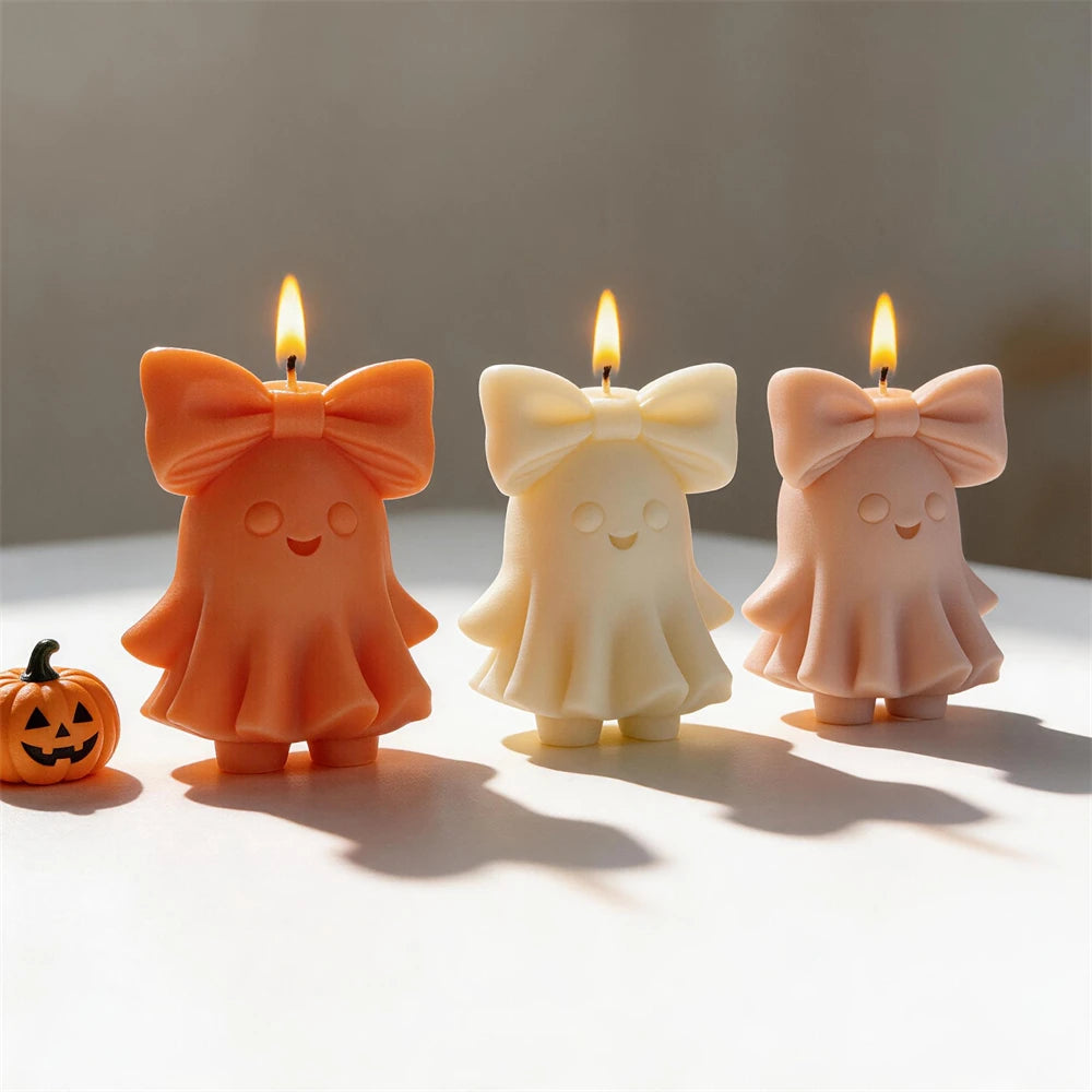 Three smiling bow ghost castings viewed from the front