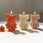 Three smiling bow ghost castings viewed from the front