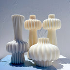 Three fluted bulb casting designs with tall stems, long necks and rounded bodies
