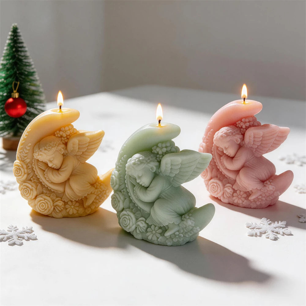 Crescent moon angel candles standing beside Christmas decorations