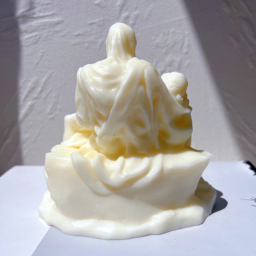 Rear view of the seated figure's robe and sculptural base