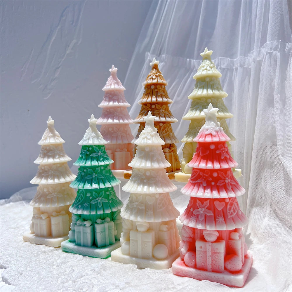 Several star-topped Christmas tree castings with gift-box bases