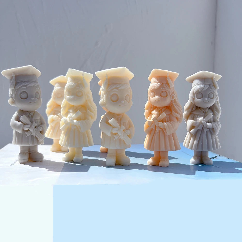 Boy and girl graduate castings grouped in sunlight