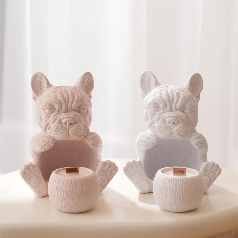 Short-muzzled puppy holder castings with small cups at their feet
