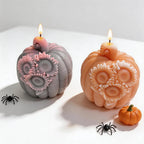 Two sunflower pumpkin candle castings viewed from the front