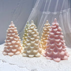 Scalloped Christmas tree samples displayed on textured fabric