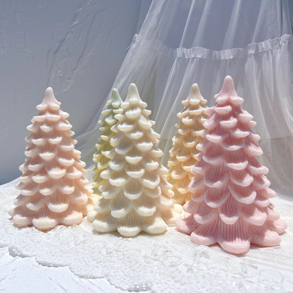 Scalloped Christmas tree samples displayed on textured fabric