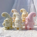 Striped Hat gnome castings with a rear view showing ridged hat texture