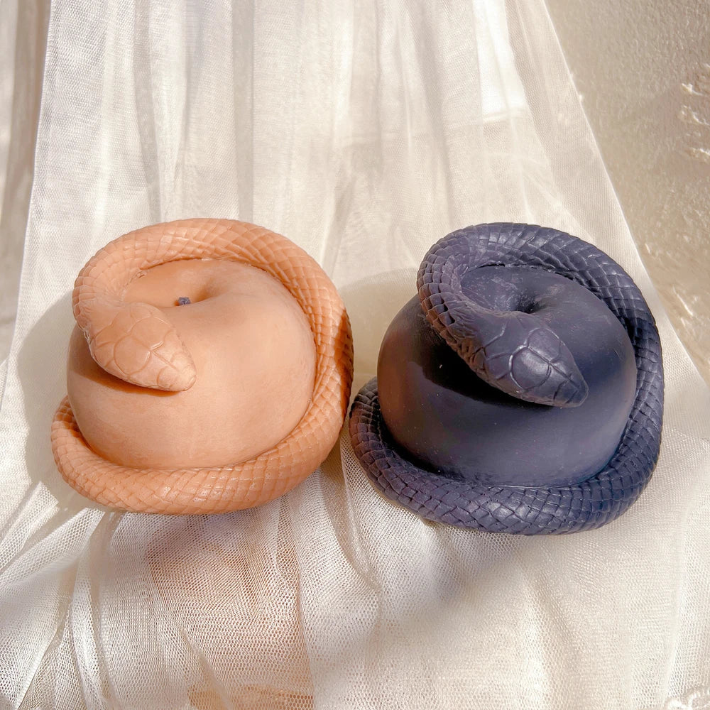 Peach and dark blue snake-and-apple castings