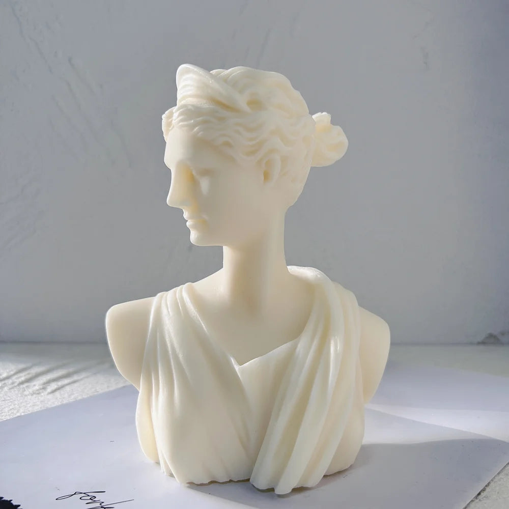 Side view of the Artemis bust with gathered hair and draped shoulders