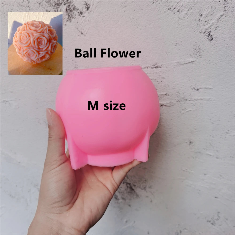 Pink Rose Ball M silicone mold held in one hand